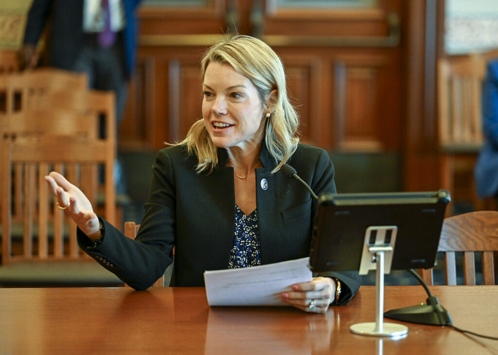 Senator Harriss sits at committee table.