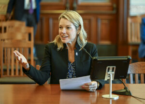 Senator Harriss sits at committee table.