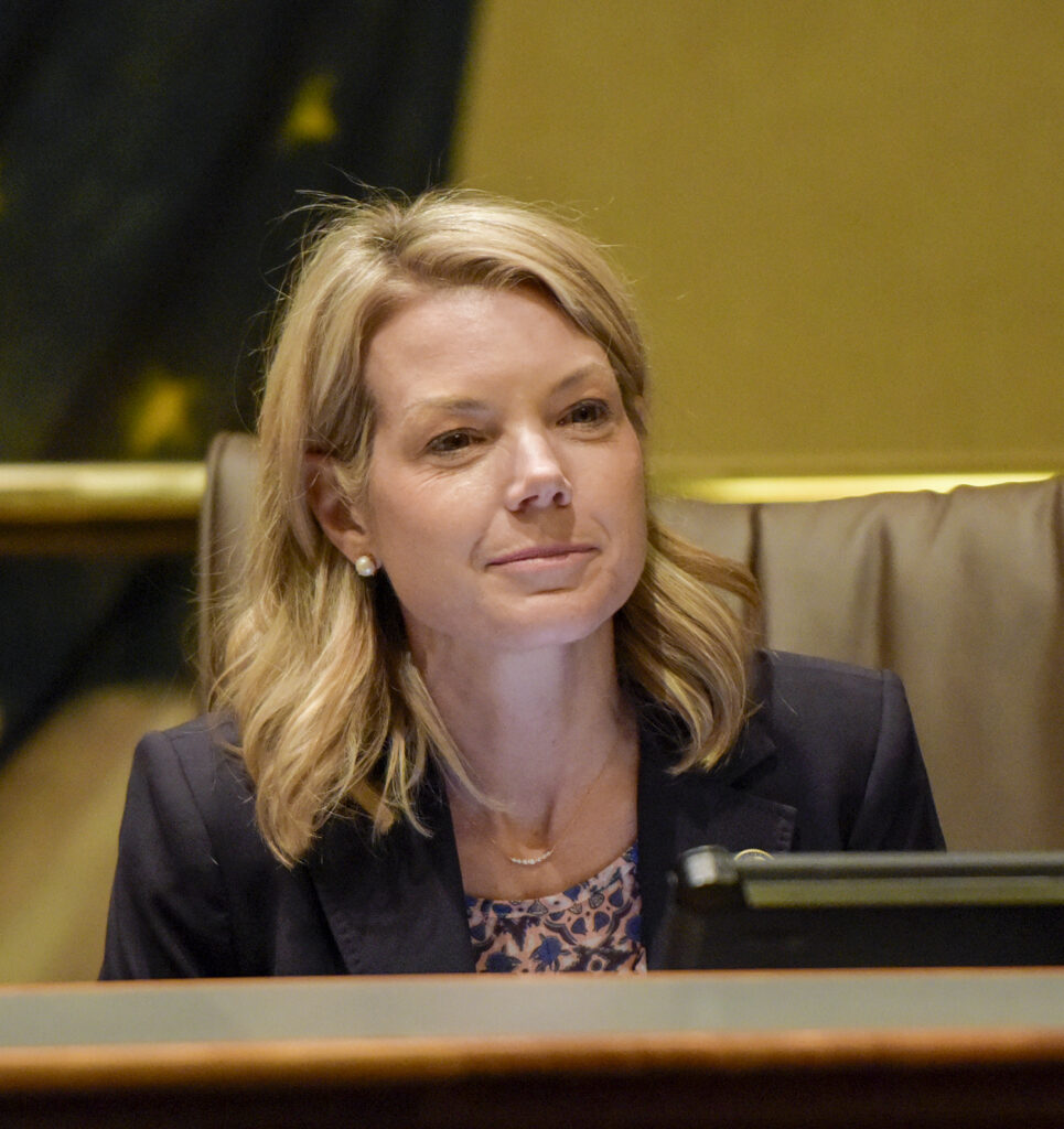Senator Harriss siting in a committee room