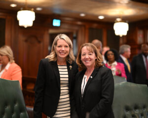 Senator Erica Harriss and Representative Amy Elik pose on House Floor for a photo.
