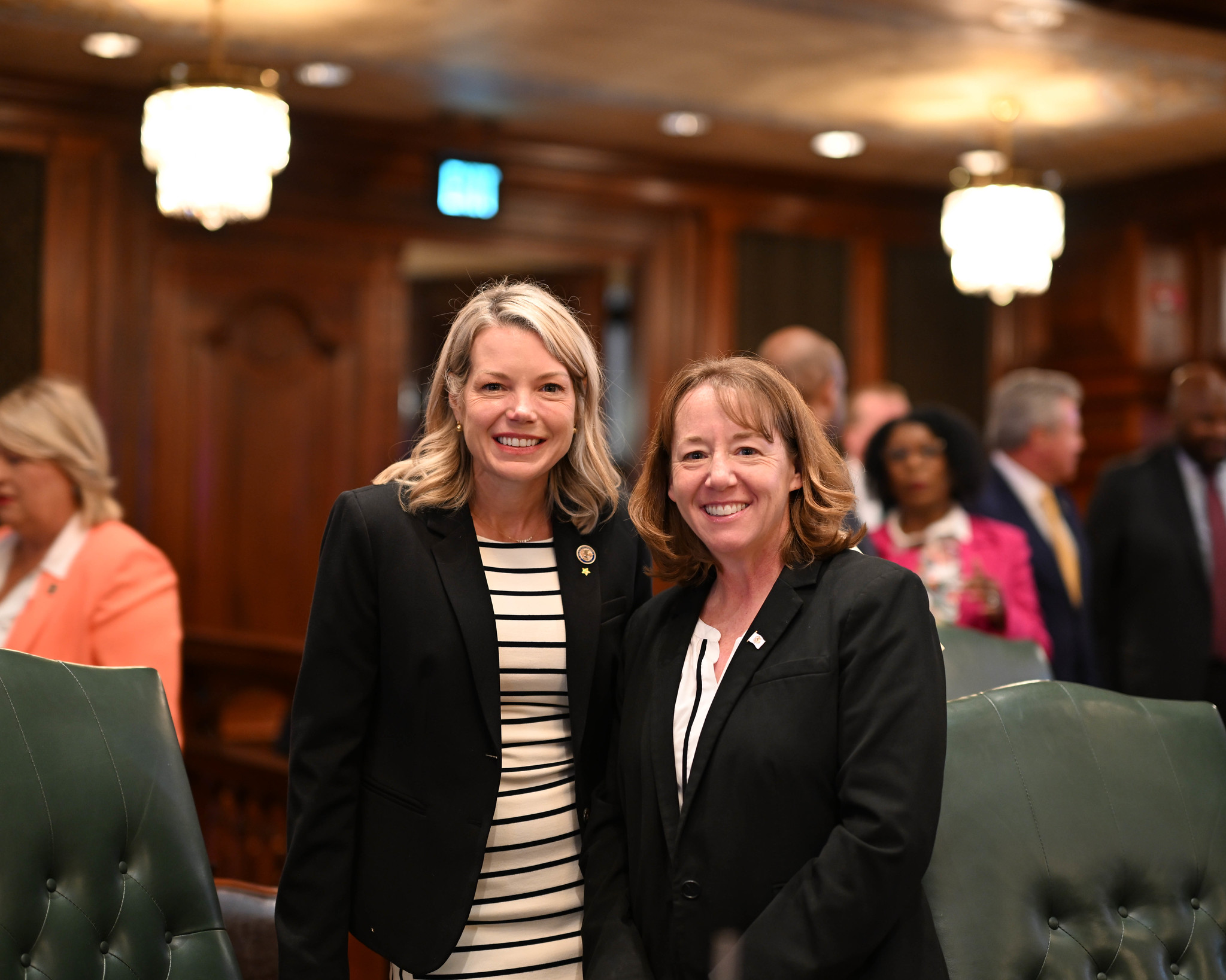 Senator Erica Harriss and Representative Amy Elik pose on House Floor for a photo.